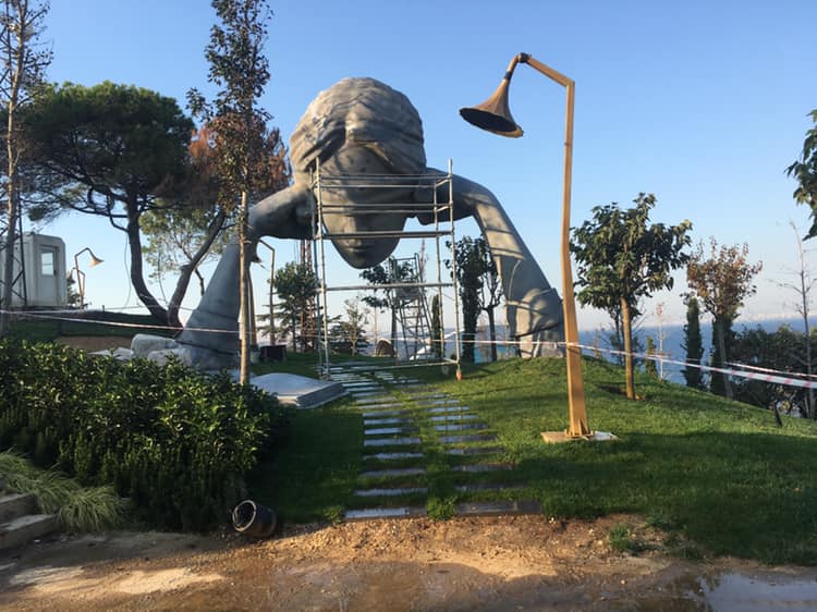 Statue of woman holding her head